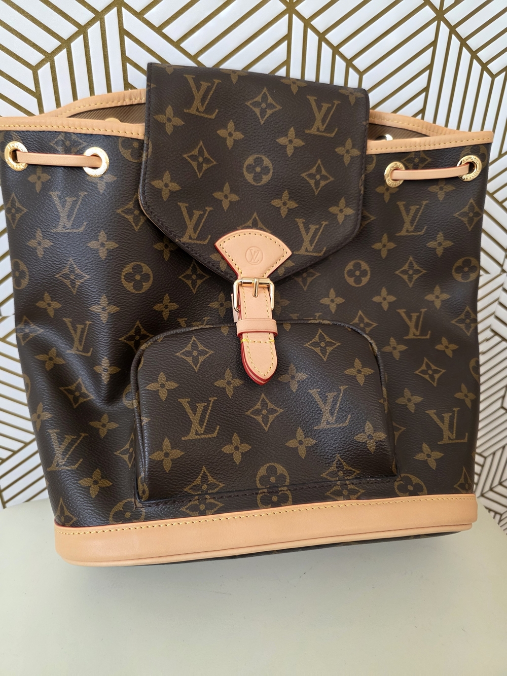 Louis Vuitton Monogram Canvas Drawstring Backpack in Brown